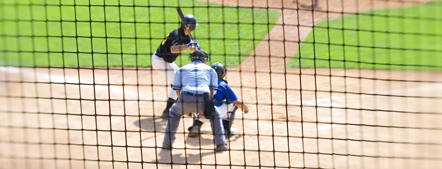 Baseball game being played at a sports venue in Central New York